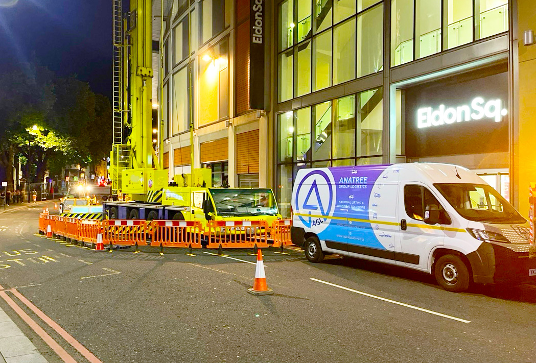 AGL crane and branded van set up for a night lift at Eldon Square, Newcastle